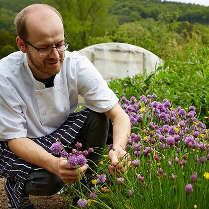 Our chef patron Andy Link picking herbs from our gardens