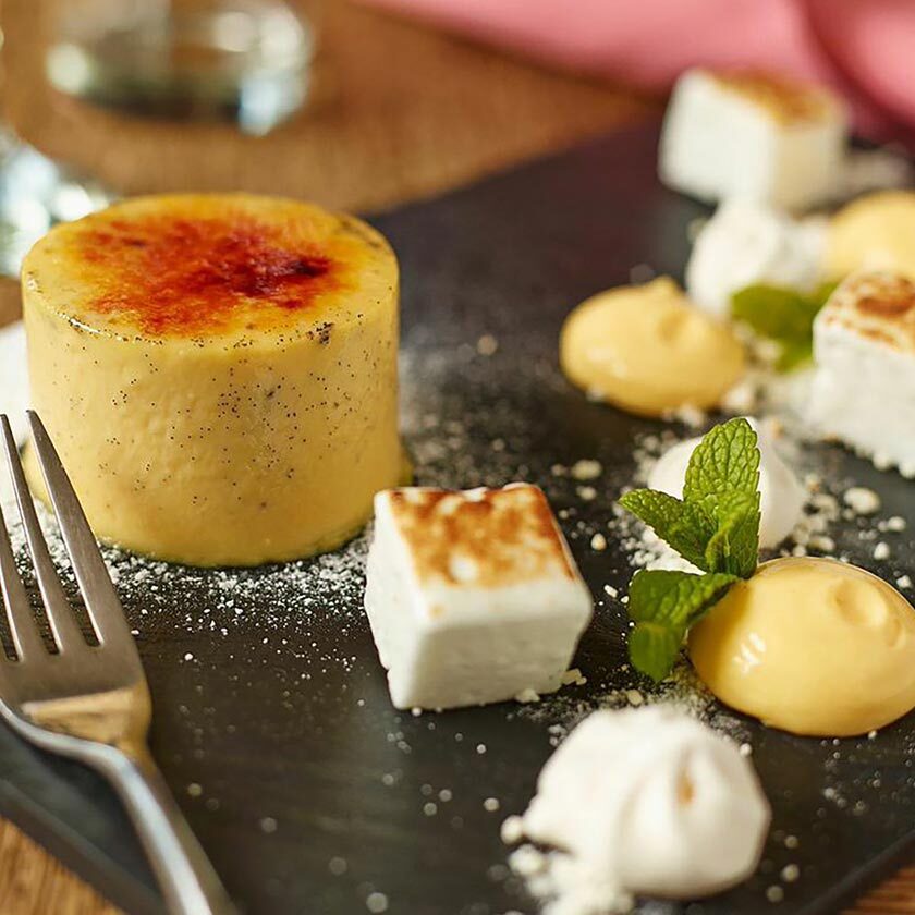 A dessert of creme Brulee, with garden lemon verbena & marshmellow